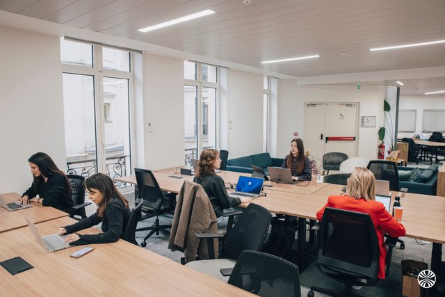 "In the strange red chair, it is our Finance Manager surrounded by her accomplices." - Wojo